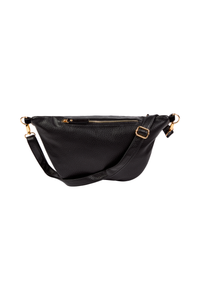 The back of a black bum bag with an adjustable strap, gold hardware and a zip compartments