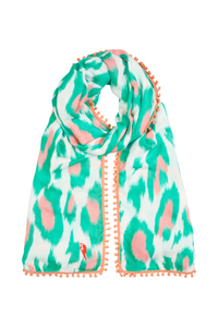A white with turquoise and peach leopard ikat and lightning bolt print scarf with a pale peach pom pom trim
