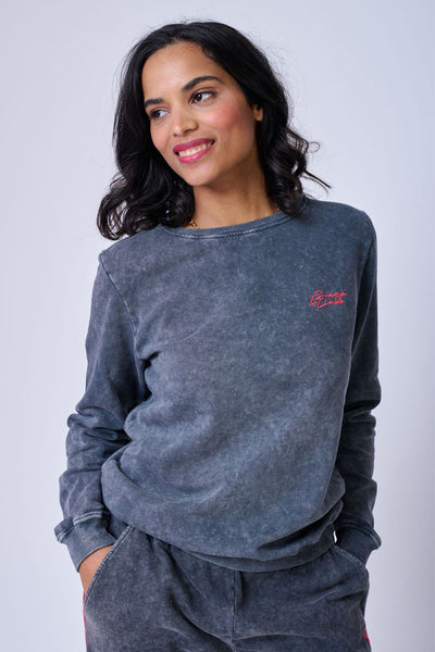 Scamp and Dude Faded Wash Dark Grey Sweatshirt | Model smiling wearing a grey sweatshirt and matching grey jogging bottoms