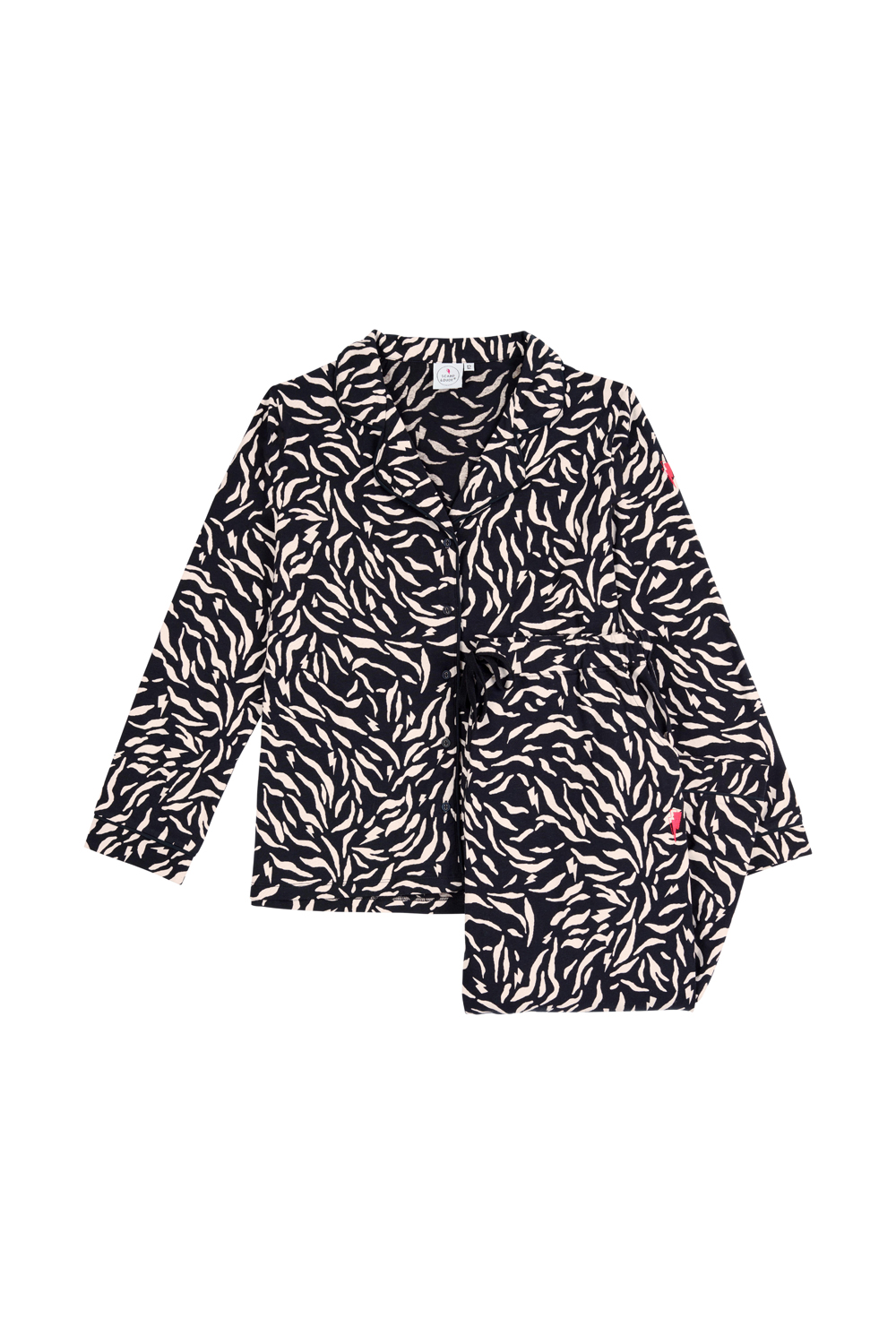 Folded black with off white zebra & lightning bolt print pyjamas, with long sleeve button front shirt & straight leg trousers