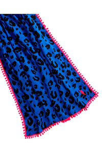 A blue with black leopard & lightning bolt print scarf with a neon pink pom pom trim and neon pink embroidered lightning bolt