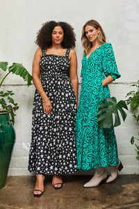 Two women in Scamp & Dude dresses in different styles and colourways